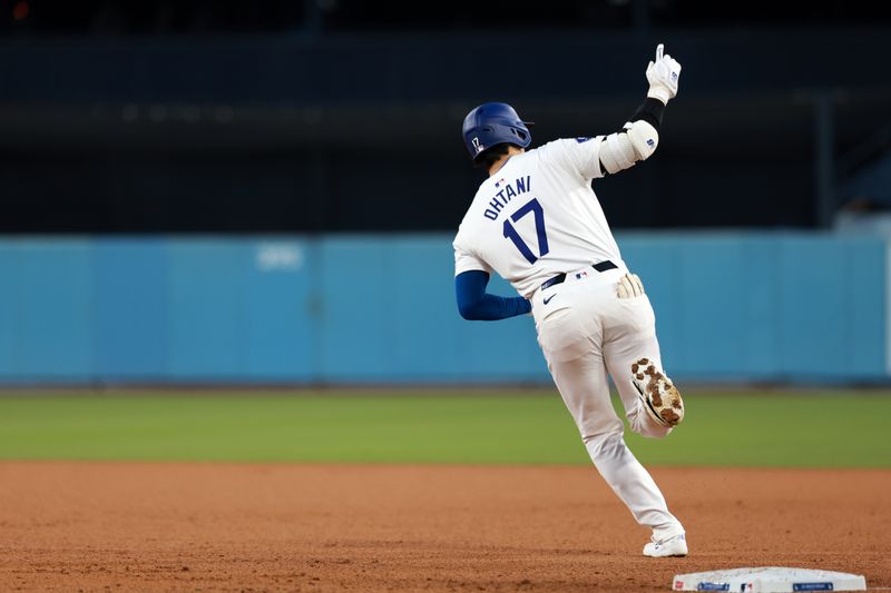 May 17, 2024; Los Angeles, California, USA;  Los Angeles Dodgers designated hitter Shohei Ohtani (17) reacts after hitting a home run during the third inning against the Cincinnati Reds at Dodger Stadium. Mandatory Credit: Kiyoshi Mio-USA TODAY Sports