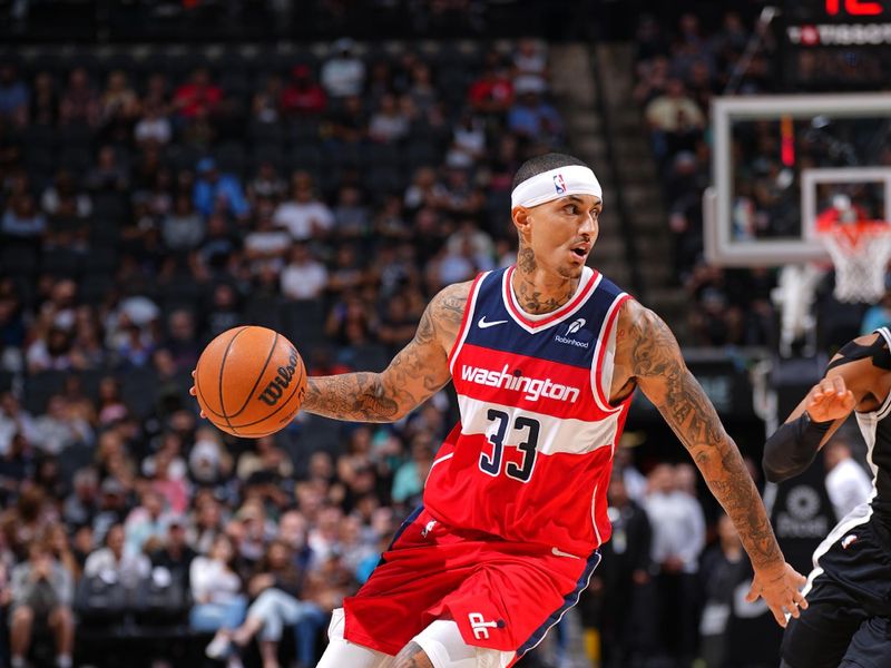 SAN ANTONIO, TX - NOVEMBER 13: Kyle Kuzma #33 of the Washington Wizards dribbles the ball during the game against the San Antonio Spurs on November 13, 2024 at the Frost Bank Center in San Antonio, Texas. NOTE TO USER: User expressly acknowledges and agrees that, by downloading and or using this photograph, user is consenting to the terms and conditions of the Getty Images License Agreement. Mandatory Copyright Notice: Copyright 2024 NBAE (Photos byGarrett Ellwood/NBAE via Getty Images)