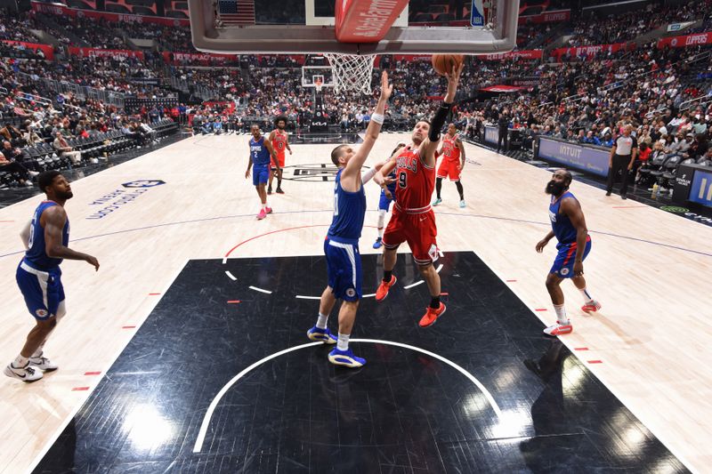 LOS ANGELES, CA - MARCH 9:  Nikola Vucevic #9 of the Chicago Bulls shoots the ball during the game against the LA Clippers on March 9, 2024 at Crypto.Com Arena in Los Angeles, California. NOTE TO USER: User expressly acknowledges and agrees that, by downloading and/or using this Photograph, user is consenting to the terms and conditions of the Getty Images License Agreement. Mandatory Copyright Notice: Copyright 2024 NBAE (Photo by Adam Pantozzi/NBAE via Getty Images)