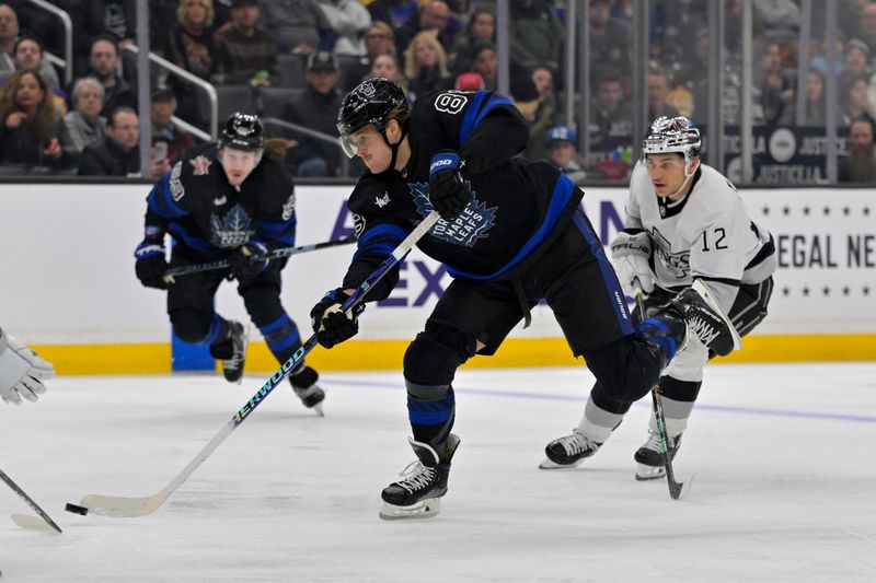 Jan 2, 2024; Los Angeles, California, USA; Toronto Maple Leafs right wing William Nylander (88) gets past Los Angeles Kings left wing Trevor Moore (12) for a shot on goal in the first period at Crypto.com Arena. Mandatory Credit: Jayne Kamin-Oncea-USA TODAY Sports