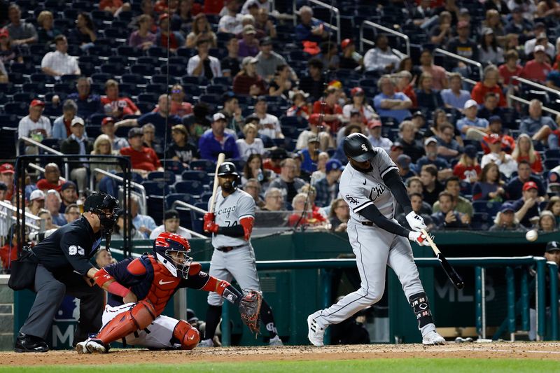 Sep 18, 2023; Washington, District of Columbia, USA; Chicago White Sox center fielder Luis Robert Jr. (88) hits a three run home run against the Washington Nationals during the fifth inning at Nationals Park. Mandatory Credit: Geoff Burke-USA TODAY Sports