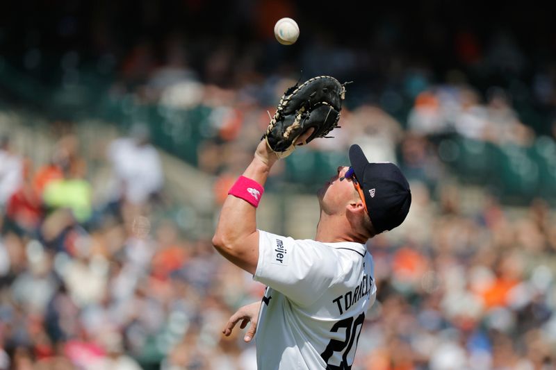 May 12, 2024; Detroit, Michigan, USA;  Detroit Tigers first baseman Spencer Torkelson (20) makes a catch in the eighth inning against the Houston Astros at Comerica Park. Mandatory Credit: Rick Osentoski-USA TODAY Sports