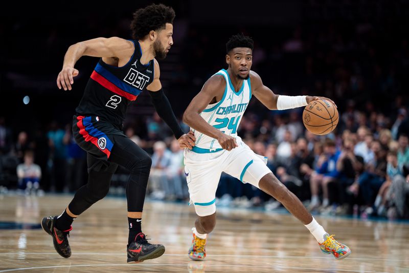 CHARLOTTE, NORTH CAROLINA - NOVEMBER 06: Brandon Miller #24 of the Charlotte Hornets dribbles the ball to the basket while guarded by Cade Cunningham #2 of the Detroit Pistons in the first quarter during their game at Spectrum Center on November 06, 2024 in Charlotte, North Carolina. NOTE TO USER: User expressly acknowledges and agrees that, by downloading and or using this photograph, User is consenting to the terms and conditions of the Getty Images License Agreement. (Photo by Jacob Kupferman/Getty Images)