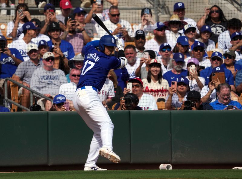 Feb 27, 2024; Phoenix, Arizona, USA; Los Angeles Dodgers designated hitter Shohei Ohtani (17) waits on deck during the fifth inning against the Chicago White Sox at Camelback Ranch-Glendale. Mandatory Credit: Joe Camporeale-USA TODAY Sports