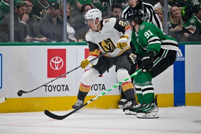 Apr 22, 2024; Dallas, Texas, USA; Vegas Golden Knights defenseman Zach Whitecloud (2) and Dallas Stars center Tyler Seguin (91) chase the puck during the third period in game one of the first round of the 2024 Stanley Cup Playoffs at the American Airlines Center. Mandatory Credit: Jerome Miron-USA TODAY Sports