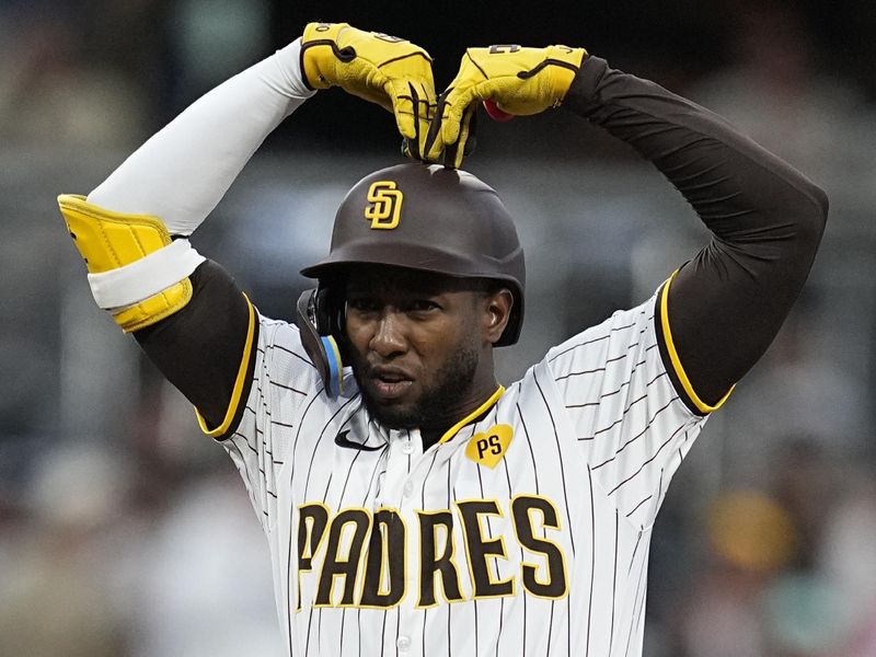 Apr 2, 2024; San Diego, California, USA; San Diego Padres left fielder Jurickson Profar (10) reacts after hitting a double against the St. Louis Cardinals during the second inning at Petco Park. Mandatory Credit: Ray Acevedo-USA TODAY Sports