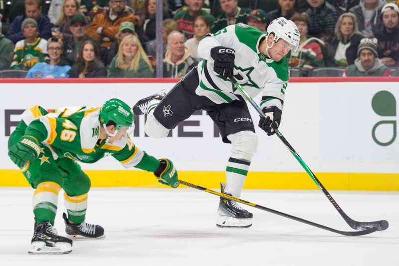 Dec 11, 2025; Saint Paul, Minnesota, USA; Dallas Stars right wing Mikko Rantanen (96) shoots over the stick of Minnesota Wild defenseman Jared Spurgeon (46) in the second period at Grand Casino Arena. Mandatory Credit: Matt Blewett-Imagn Images
