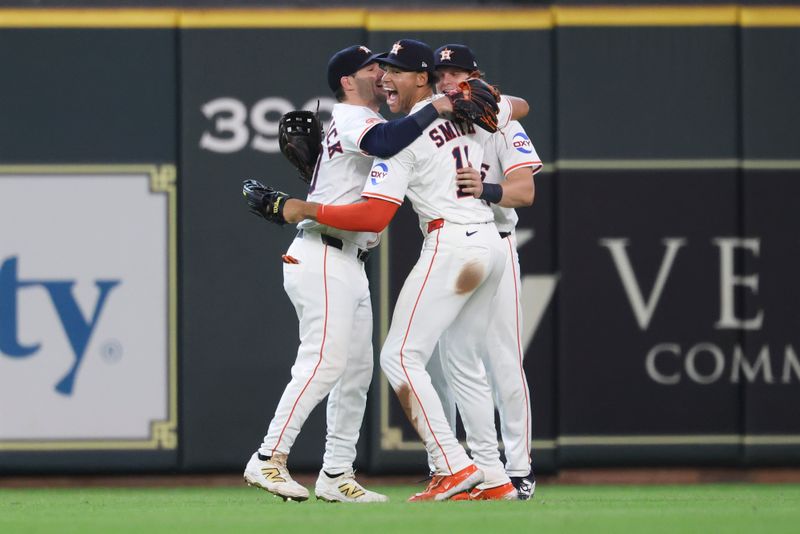 May 24, 2025; Houston, Texas, USA; Houston Astros right fielder Cam Smith (11) celebrates with center fielder Chas McCormick (20) and center fielder Jake Meyers (6) after the game against the Seattle Mariners at Daikin Park. Mandatory Credit: Troy Taormina-Imagn Images