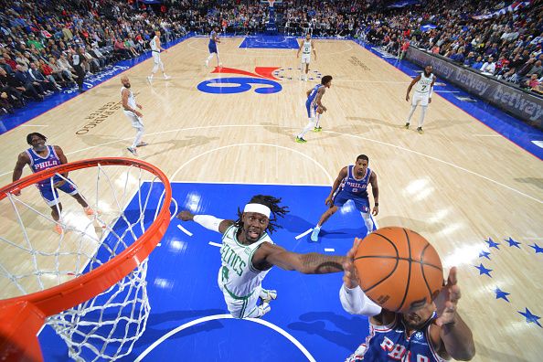 PHILADELPHIA, PA - NOVEMBER 8: Jrue Holiday #4 of the Boston Celtics goes for the rebound during the game against the Philadelphia 76ers on November 8, 2023 at the Wells Fargo Center in Philadelphia, Pennsylvania NOTE TO USER: User expressly acknowledges and agrees that, by downloading and/or using this Photograph, user is consenting to the terms and conditions of the Getty Images License Agreement. Mandatory Copyright Notice: Copyright 2023 NBAE (Photo by Jesse D. Garrabrant/NBAE via Getty Images)