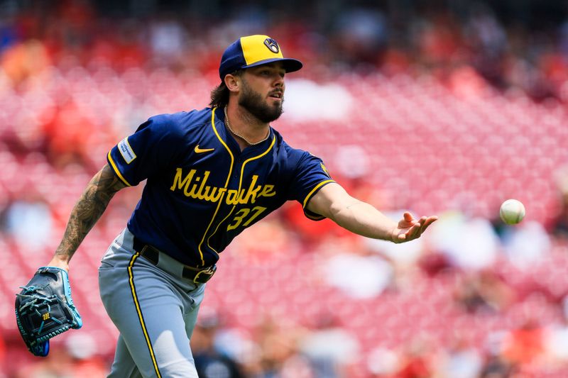 Jun 4, 2025; Cincinnati, Ohio, USA; Milwaukee Brewers starting pitcher DL Hall (37) throws to first to get Cincinnati Reds designated hitter Tyler Stephenson (not pictured) out in the second inning at Great American Ball Park. Mandatory Credit: Katie Stratman-Imagn Images