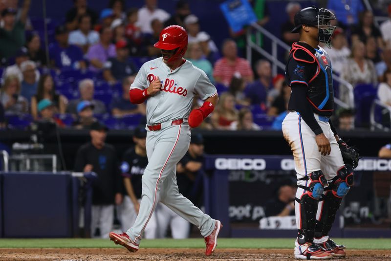 May 10, 2024; Miami, Florida, USA; Philadelphia Phillies second baseman Whit Merrifield (9) scores against the Miami Marlins during the fourth inning at loanDepot Park. Mandatory Credit: Sam Navarro-USA TODAY Sports