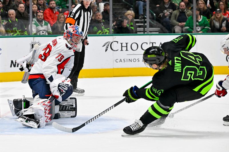 Jan 27, 2024; Dallas, Texas, USA; Washington Capitals goaltender Charlie Lindgren (79) stops a shot byDallas Stars center Roope Hintz (24) during the second period at the American Airlines Center. Mandatory Credit: Jerome Miron-USA TODAY Sports