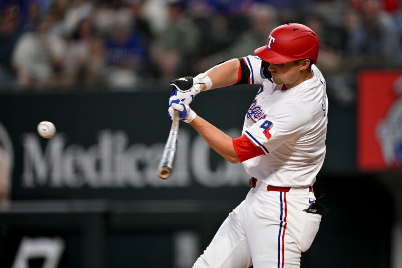 Jun 28, 2025; Arlington, Texas, USA; Texas Rangers shortstop Corey Seager (5) hits a two run home run against the Seattle Mariners during the third inning at Globe Life Field. Mandatory Credit: Jerome Miron-Imagn Images