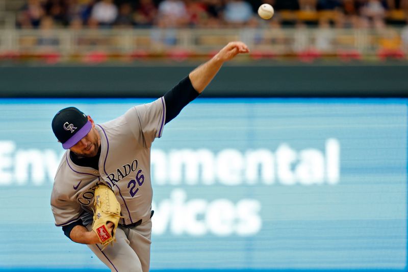 Jun 12, 2024; Minneapolis, Minnesota, USA; Colorado Rockies starting pitcher Austin Gomber (26) throws to the Minnesota Twins in the first inning at Target Field. Mandatory Credit: Bruce Kluckhohn-USA TODAY Sports