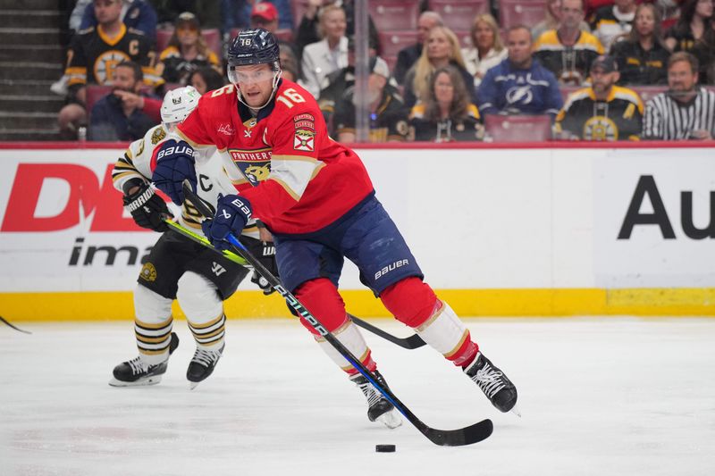 Mar 26, 2024; Sunrise, Florida, USA; Florida Panthers center Aleksander Barkov (16) brings the puck up the ice against the Boston Bruins in the first period at Amerant Bank Arena. Mandatory Credit: Jim Rassol-USA TODAY Sports