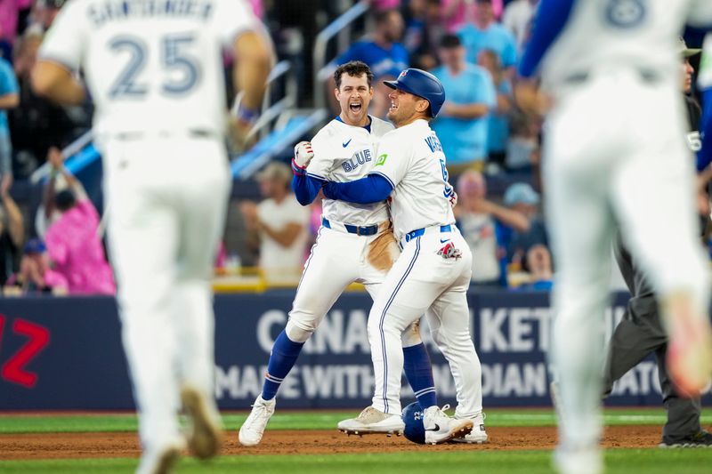 May 17, 2025; Toronto, Ontario, CAN; Toronto Blue Jays third base Ernie Clement (22) celebrates after hitting a walk off single to defeat the Detroit Tigers during the ninth inning in their MLB game at Rogers Centre. Mandatory Credit: Kevin Sousa-Imagn Images