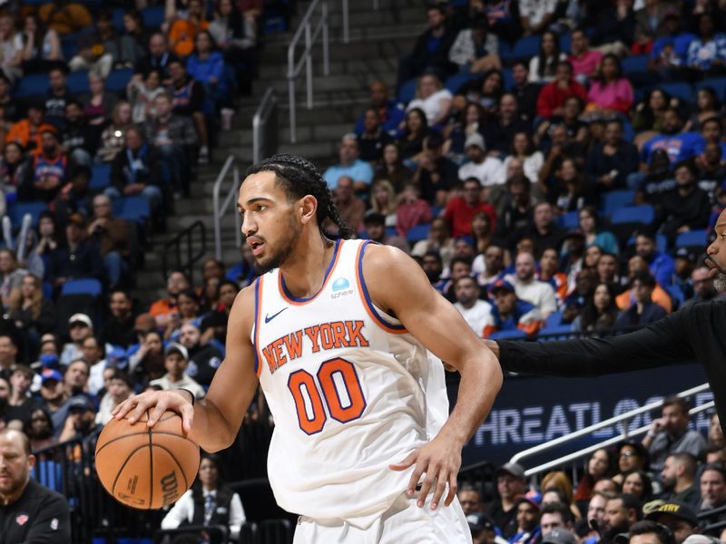 ORLANDO, FL - FEBRUARY 14: Jacob Toppin #00 of the New York Knicks dribbles the ball during the game against the Orlando Magic on February 14, 2024 at the Kia Center in Orlando, Florida. NOTE TO USER: User expressly acknowledges and agrees that, by downloading and or using this photograph, User is consenting to the terms and conditions of the Getty Images License Agreement. Mandatory Copyright Notice: Copyright 2024 NBAE (Photo by Fernando Medina/NBAE via Getty Images)