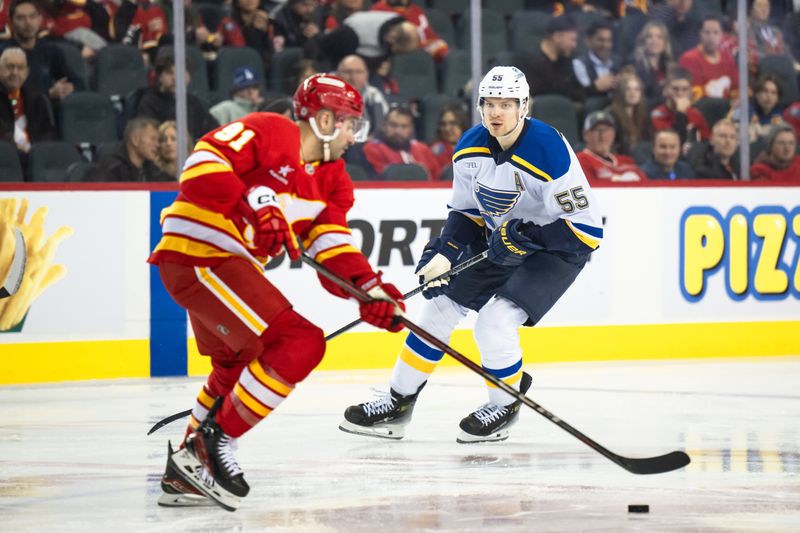 Dec 5, 2024; Calgary, Alberta, CAN; St. Louis Blues defenseman Colton Parayko (55) defends against Calgary Flames center Nazem Kadri (91) during the first period at Scotiabank Saddledome. Mandatory Credit: Brett Holmes-Imagn Images