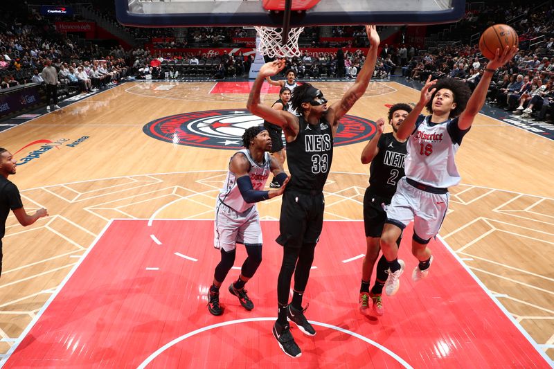 WASHINGTON, DC -? FEBRUARY 24: Kyshawn George #18 of the Washington Wizards drives to the basket during the game against the Brooklyn Nets on February 24, 2025 at Capital One Arena in Washington, DC. NOTE TO USER: User expressly acknowledges and agrees that, by downloading and or using this Photograph, user is consenting to the terms and conditions of the Getty Images License Agreement. Mandatory Copyright Notice: Copyright 2025 NBAE (Photo by Kenny Giarla/NBAE via Getty Images)