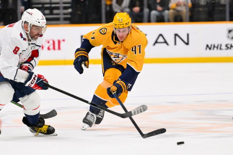 Jan 11, 2026; Nashville, Tennessee, USA;  Nashville Predators right wing Michael McCarron (47) steals the puck from Washington Capitals left wing Alex Ovechkin (8) during the third period at Bridgestone Arena. Mandatory Credit: Steve Roberts-Imagn Images