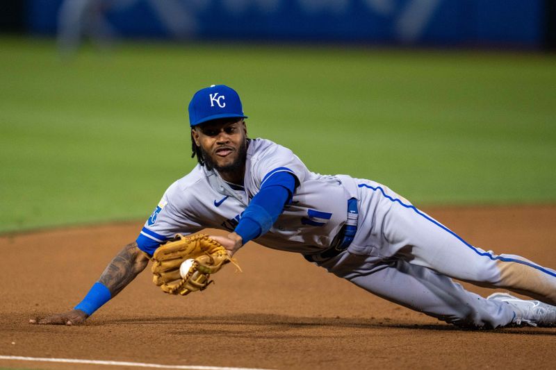 Aug 21, 2023; Oakland, California, USA;  Kansas City Royals third baseman Maikel Garcia (11) makes a diving stop on a ground ball hit by Oakland Athletics second baseman Zack Gelof (not pictured) during the fifth inning at Oakland-Alameda County Coliseum. Mandatory Credit: Neville E. Guard-USA TODAY Sports