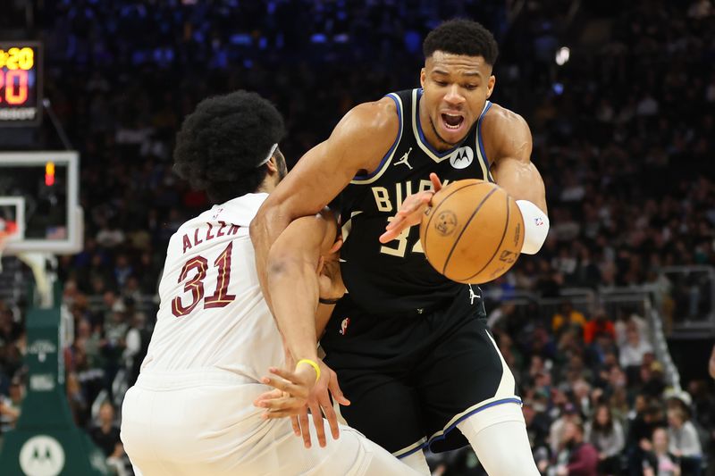 MILWAUKEE, WISCONSIN - JANUARY 26: Jarrett Allen #31 of the Cleveland Cavaliers is fouled by Giannis Antetokounmpo #34 of the Milwaukee Bucks during the first half of a game at Fiserv Forum on January 26, 2024 in Milwaukee, Wisconsin. NOTE TO USER: User expressly acknowledges and agrees that, by downloading and or using this photograph, User is consenting to the terms and conditions of the Getty Images License Agreement. (Photo by Stacy Revere/Getty Images)