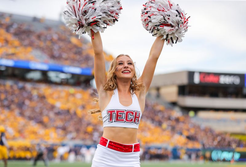 Oct 2, 2021; Morgantown, West Virginia, USA; A Texas Tech Red Raiders cheerleader performs during the first quarter against the West Virginia Mountaineers at Mountaineer Field at Milan Puskar Stadium. Mandatory Credit: Ben Queen-USA TODAY Sports