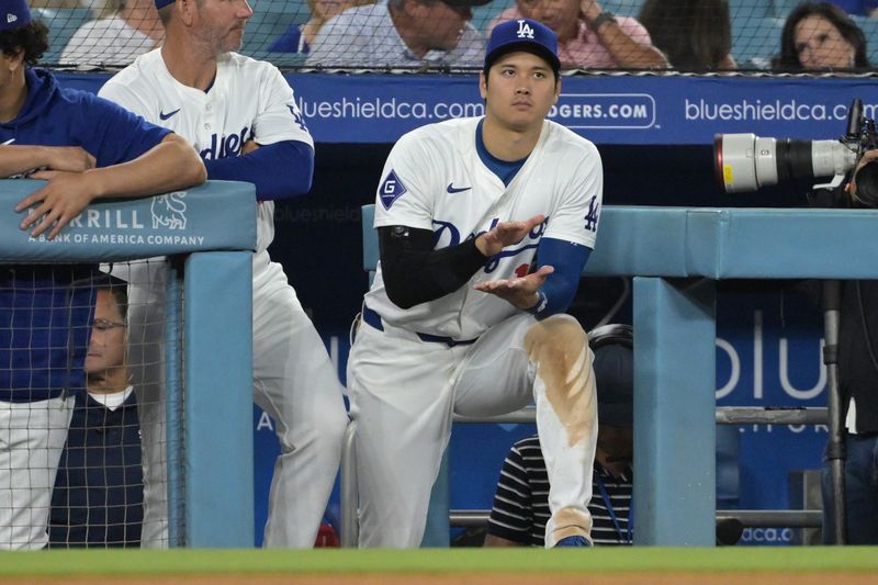 Jul 22, 2024; Los Angeles, California, USA;  Los Angeles Dodgers designated hitter Shohei Ohtani (17) looks on from the dugout during the ninth inning against the San Francisco Giants at Dodger Stadium. Mandatory Credit: Jayne Kamin-Oncea-USA TODAY Sports