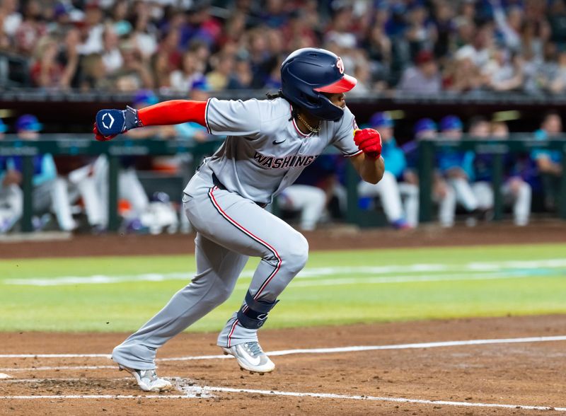 May 30, 2025; Phoenix, Arizona, USA; Washington Nationals infielder Jose Tena hits a third inning triple against the Arizona Diamondbacks at Chase Field. Mandatory Credit: Mark J. Rebilas-Imagn Images