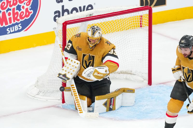 May 6, 2025; Las Vegas, Nevada, USA; Vegas Golden Knights goaltender Adin Hill (33) makes a save against the Edmonton Oilers during the third period of game one of the second round of the 2025 Stanley Cup Playoffs at T-Mobile Arena. Mandatory Credit: Stephen R. Sylvanie-Imagn Images