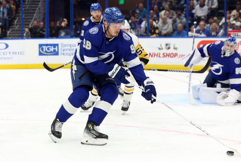 Dec 6, 2023; Tampa, Florida, USA; Tampa Bay Lightning defenseman Mikhail Sergachev (98) skates with the puck against the Pittsburgh Penguins during the second period at Amalie Arena. Mandatory Credit: Kim Klement Neitzel-USA TODAY Sports