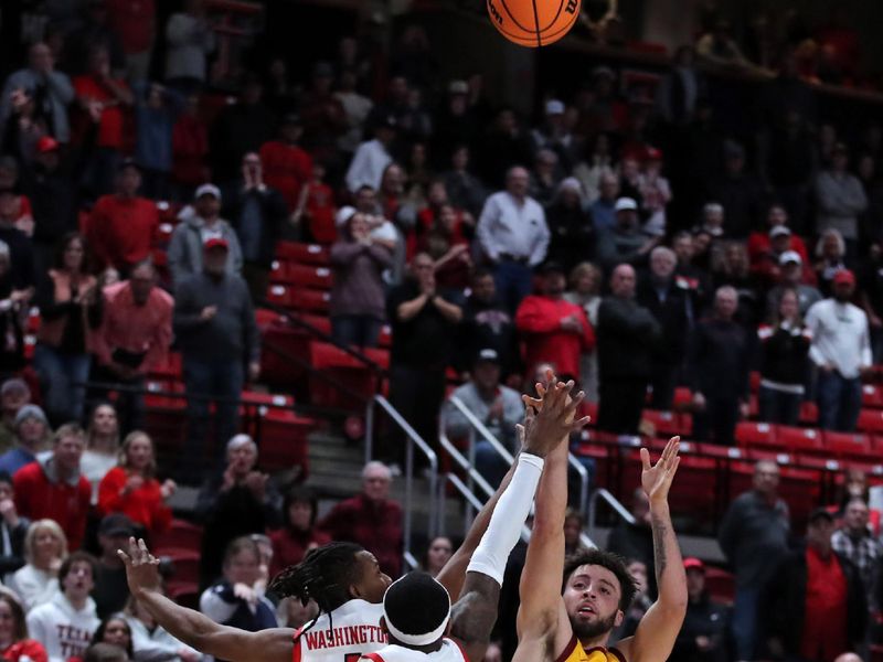 Jan 30, 2023; Lubbock, Texas, USA;  Iowa State Cyclones guard Gabe Kalscheur (22) takes a three point shot over Texas Tech Red Raiders guard Lamar Washington (1) and De   Vion Harmon (23) in the second half at United Supermarkets Arena. Mandatory Credit: Michael C. Johnson-USA TODAY Sports