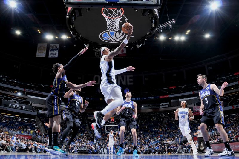 ORLANDO, FL - JANUARY 25: Paolo Banchero #5 of the Orlando Magic goes to the basket against the Indiana Pacers on January 25, 2023 at Amway Center in Orlando, Florida. NOTE TO USER: User expressly acknowledges and agrees that, by downloading and or using this photograph, User is consenting to the terms and conditions of the Getty Images License Agreement. Mandatory Copyright Notice: Copyright 2023 NBAE (Photo by Fernando Medina/NBAE via Getty Images)