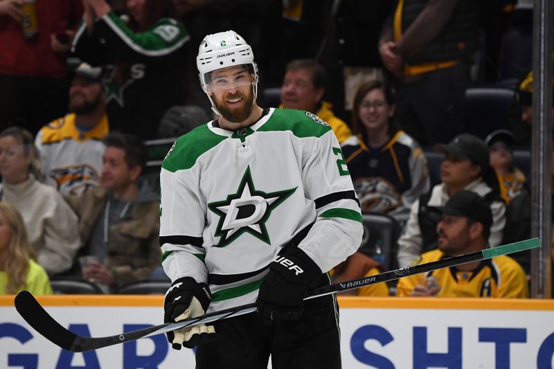 Dec 23, 2023; Nashville, Tennessee, USA; Dallas Stars defenseman Jani Hakanpaa (2) celebrates with teammates after scoring the game-winning goal late in the third period to beat the Nashville Predators at Bridgestone Arena. Mandatory Credit: Christopher Hanewinckel-USA TODAY Sports