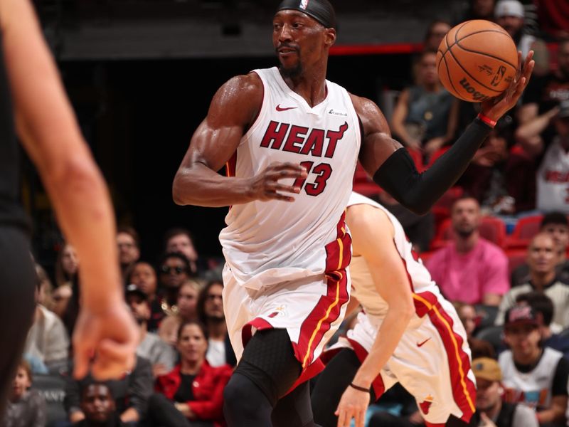 MIAMI, FL - JANUARY 8: Bam Adebayo #13 of the Miami Heat passes the ball during the game against the Houston Rockets on January 8, 2024 at Kaseya Center in Miami, Florida. NOTE TO USER: User expressly acknowledges and agrees that, by downloading and or using this Photograph, user is consenting to the terms and conditions of the Getty Images License Agreement. Mandatory Copyright Notice: Copyright 2024 NBAE (Photo by Issac Baldizon/NBAE via Getty Images)