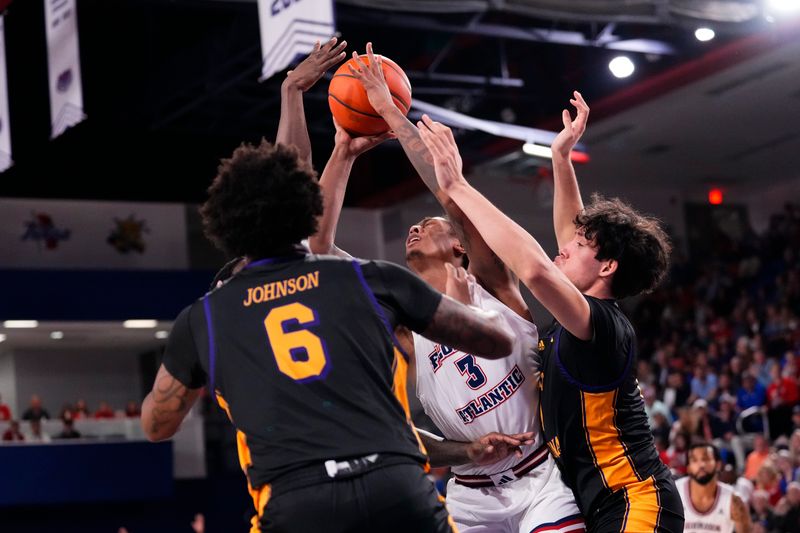 Jan 2, 2024; Boca Raton, Florida, USA; Florida Atlantic Owls forward Giancarlo Rosado (3) drives to the basket against the East Carolina Pirates during the second half at Eleanor R. Baldwin Arena. Mandatory Credit: Rich Storry-USA TODAY Sports