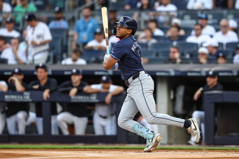 Jul 19, 2024; Bronx, New York, USA;  Tampa Bay Rays second baseman Richie Palacios (1) hits a single in the first inning against the New York Yankees at Yankee Stadium. Mandatory Credit: Wendell Cruz-USA TODAY Sports