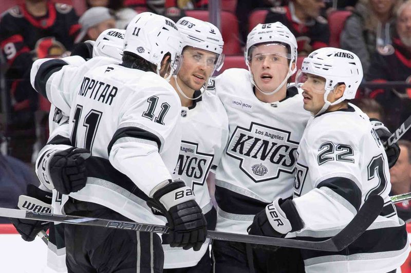 Oct 14, 2024; Ottawa, Ontario, CAN; The Los Angeles Kings celebrate a goal scored by right wing Adrian Kempe (9) in the second period against the Ottawa Senators at the Canadian Tire Centre. Mandatory Credit: Marc DesRosiers-Imagn Images