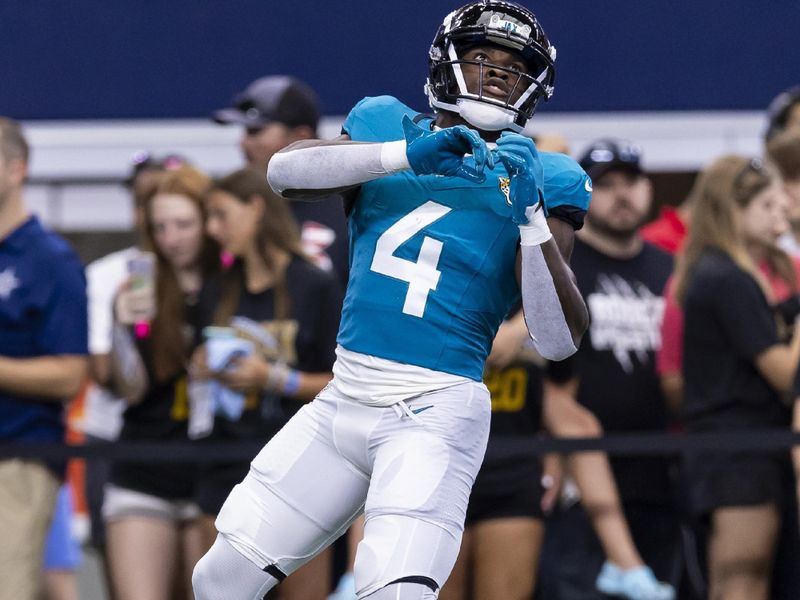 Jacksonville Jaguars running back Tank Bigsby (4) catches a pass during warm ups before an NFL football game against the Dallas Cowboys, Saturday, Aug. 12, 2023, in Arlington, Texas. Jacksonville won 28-23. (AP Photo/Brandon Wade)