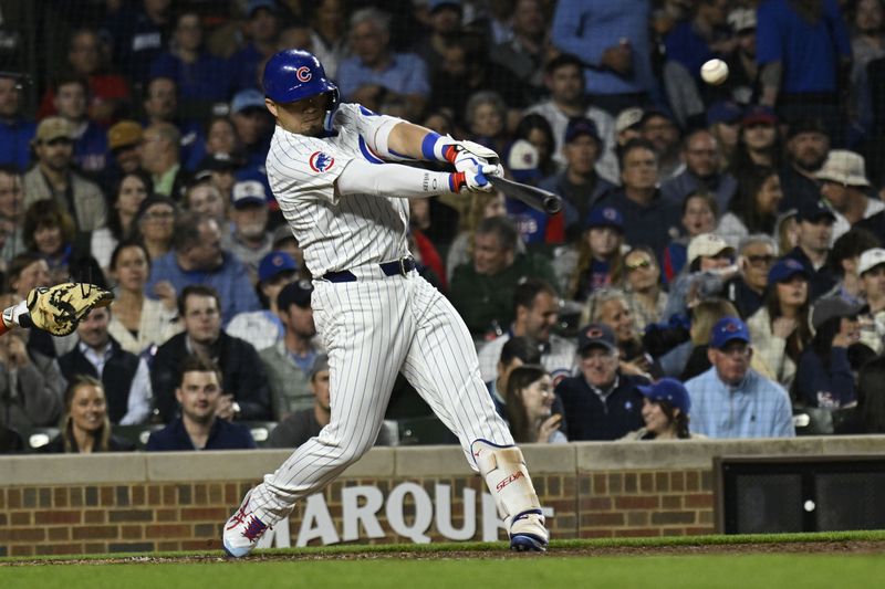 May 6, 2025; Chicago, Illinois, USA;  Chicago Cubs outfielder Seiya Suzuki (27) flies out during the fifth inning against the San Francisco Giants at Wrigley Field. Mandatory Credit: Matt Marton-Imagn Images