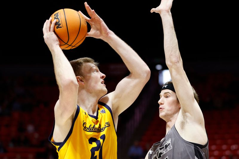 Feb 5, 2023; Salt Lake City, Utah, USA; California Golden Bears forward Lars Thiemann (21) looks to shoot against Utah Utes center Branden Carlson (35) in the first half at Jon M. Huntsman Center. Mandatory Credit: Jeffrey Swinger-USA TODAY Sports