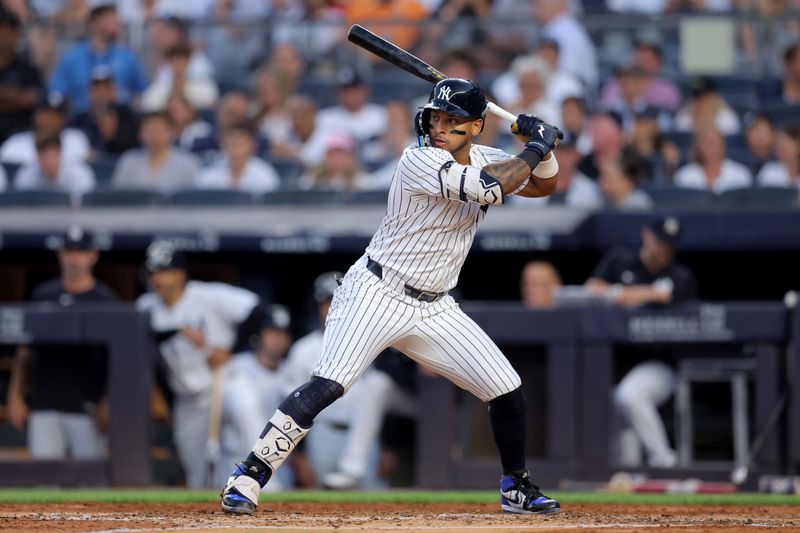 Jul 10, 2025; Bronx, New York, USA; New York Yankees third baseman Jorbit Vivas (90) bats against the Seattle Mariners during the third inning at Yankee Stadium. Mandatory Credit: Brad Penner-Imagn Images