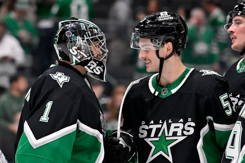 Nov 30, 2025; Dallas, Texas, USA; Dallas Stars goaltender Casey DeSmith (1) and center Wyatt Johnston (53) celebrate the Stars victory over the Ottawa Senators at the American Airlines Center. Mandatory Credit: Jerome Miron-Imagn Images