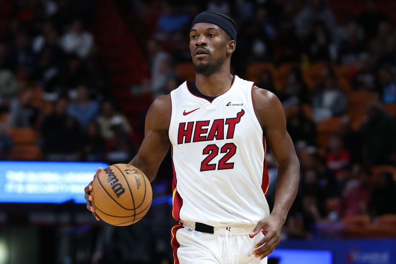 MIAMI, FLORIDA - JANUARY 31: Jimmy Butler #22 of the Miami Heat dribbles the ball against the Sacramento Kings during the third quarter of the game at Kaseya Center on January 31, 2024 in Miami, Florida. NOTE TO USER: User expressly acknowledges and agrees that, by downloading and or using this photograph, User is consenting to the terms and conditions of the Getty Images License Agreement. (Photo by Megan Briggs/Getty Images)