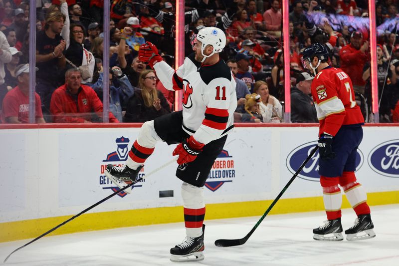 Nov 14, 2024; Sunrise, Florida, USA; New Jersey Devils right wing Stefan Noesen (11) celebrates after scoring against the Florida Panthers during the first period at Amerant Bank Arena. Mandatory Credit: Sam Navarro-Imagn Images