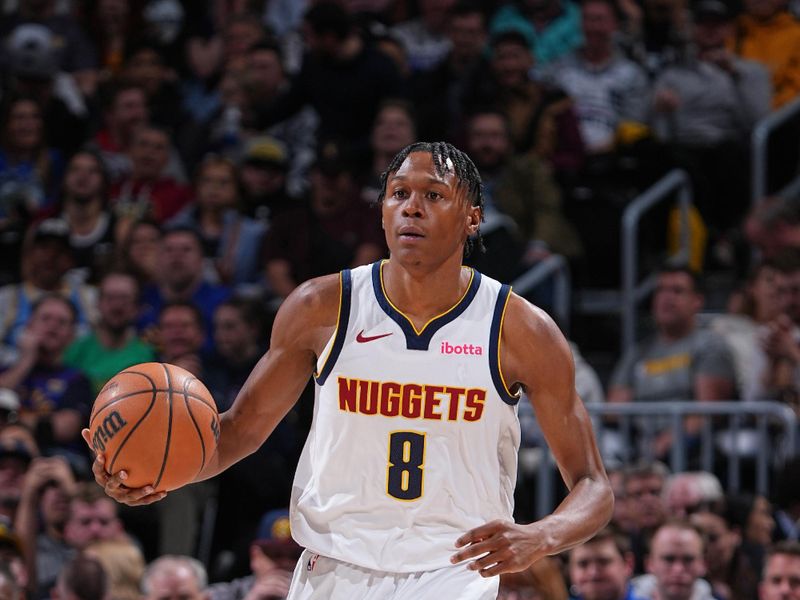 DENVER, CO - FEBRUARY 28: Peyton Watson #8 of the Denver Nuggets brings the ball up court during the game against the Sacramento Kings on February 28, 2024 at the Ball Arena in Denver, Colorado. NOTE TO USER: User expressly acknowledges and agrees that, by downloading and/or using this Photograph, user is consenting to the terms and conditions of the Getty Images License Agreement. Mandatory Copyright Notice: Copyright 2024 NBAE (Photo by Garrett Ellwood/NBAE via Getty Images)