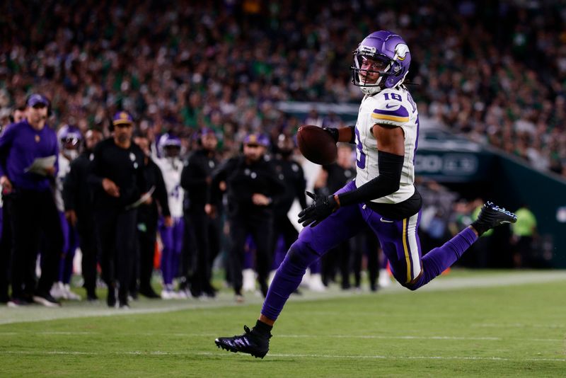 Minnesota Vikings wide receiver Justin Jefferson (18) makes a catch against the Philadelphia Eagles during an NFL football game, Thursday, Sep. 14, 2023, in Philadelphia. (AP Photo/Rich Schultz)