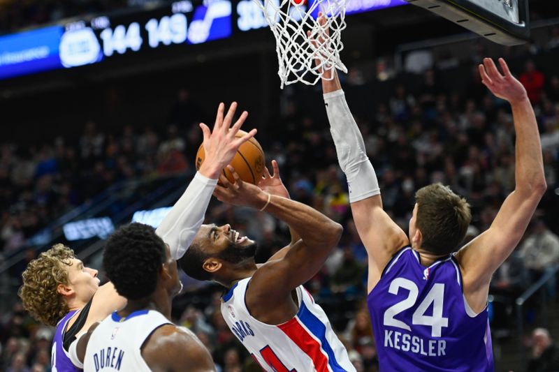 SALT LAKE CITY, UTAH - JANUARY 03: Alec Burks #14 of the Detroit Pistons shoots over Walker Kessler #24 of the Utah Jazz during the second half of a game at Delta Center on January 03, 2024 in Salt Lake City, Utah. NOTE TO USER: User expressly acknowledges and agrees that, by downloading and or using this photograph, User is consenting to the terms and conditions of the Getty Images License Agreement. (Photo by Alex Goodlett/Getty Images)