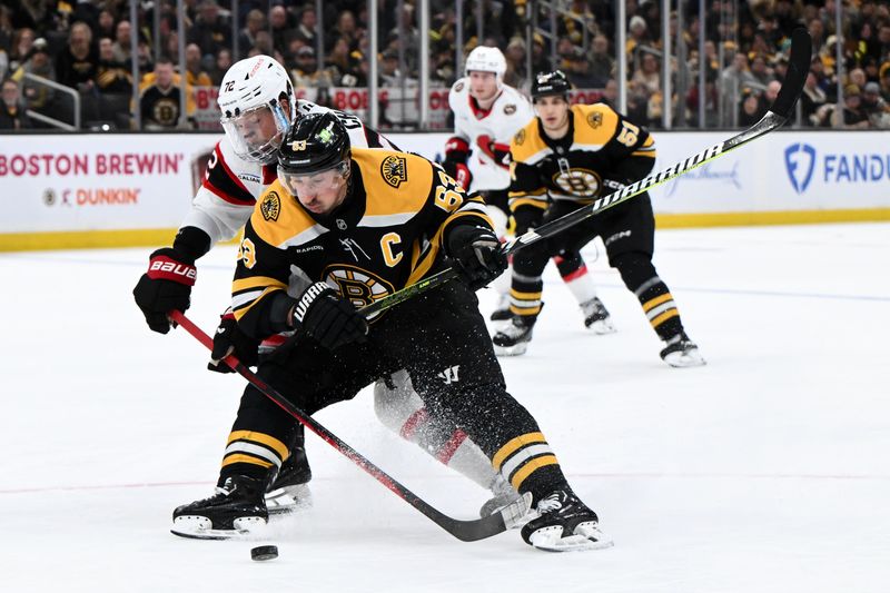 Jan 23, 2025; Boston, Massachusetts, USA; Ottawa Senators defenseman Thomas Chabot (72) defends Boston Bruins left wing Brad Marchand (63) during the third period at the TD Garden. Mandatory Credit: Brian Fluharty-Imagn Images