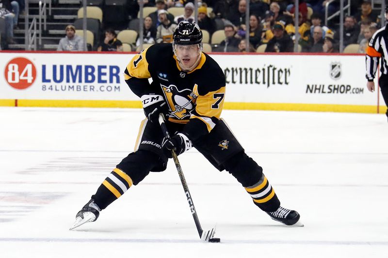 Jan 13, 2023; Pittsburgh, Pennsylvania, USA; Pittsburgh Penguins center Evgeni Malkin (71) skates into the offensive zone with the puck against the Winnipeg Jets during the third period at PPG Paints Arena. Mandatory Credit: Charles LeClaire-USA TODAY Sports